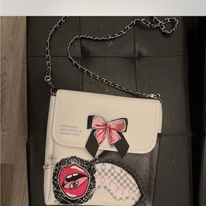 Sprayground White and Black Crossbody Bag with Pink Bow